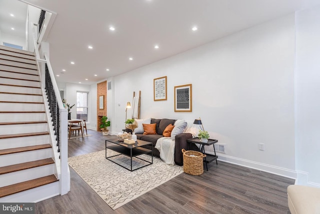 living room featuring dark hardwood / wood-style flooring