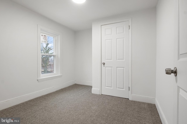 unfurnished bedroom featuring carpet flooring