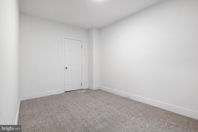 spare room with carpet floors