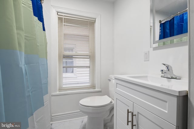 bathroom featuring vanity and toilet