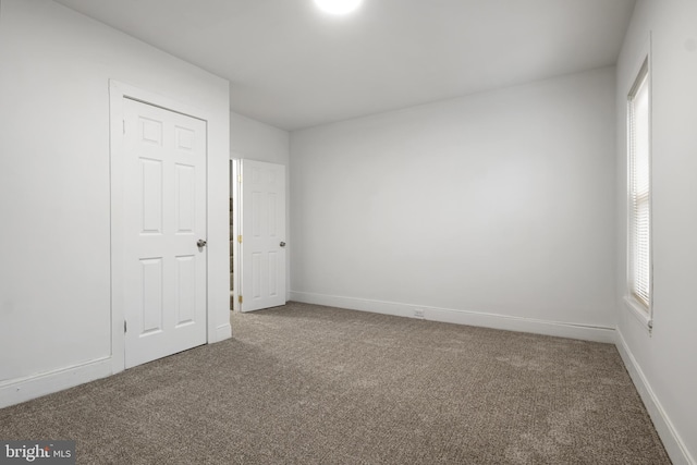 unfurnished bedroom with carpet floors