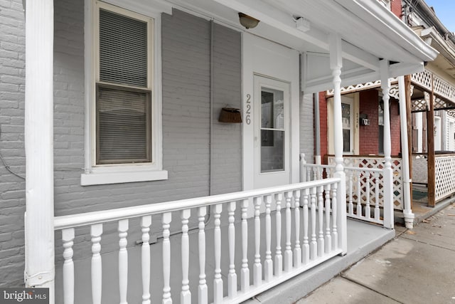 property entrance featuring covered porch