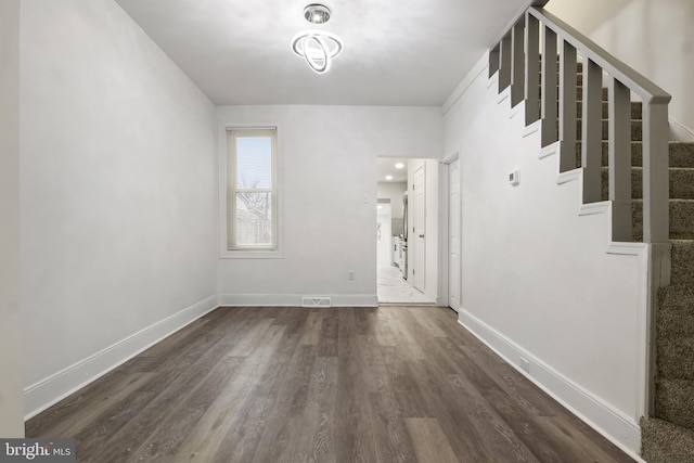 entrance foyer featuring dark hardwood / wood-style floors