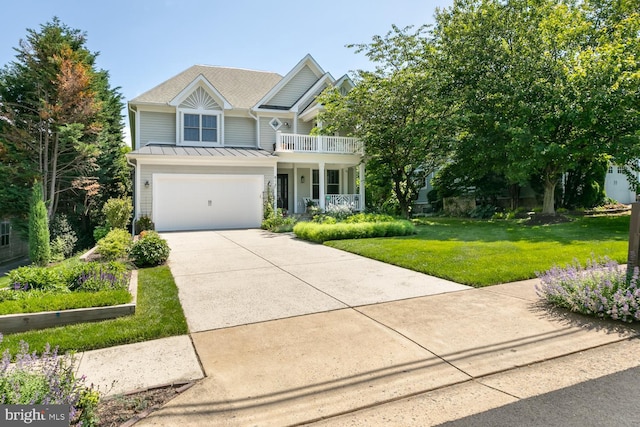 view of front of property featuring driveway, a garage, a balcony, covered porch, and a front lawn