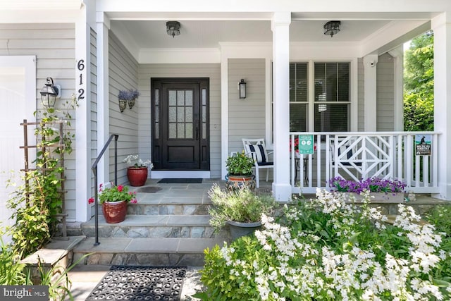 doorway to property featuring a porch