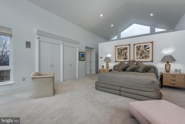 carpeted bedroom featuring high vaulted ceiling