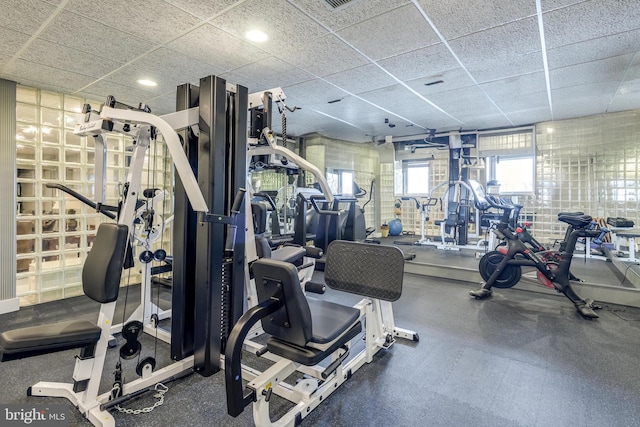 workout area with a drop ceiling