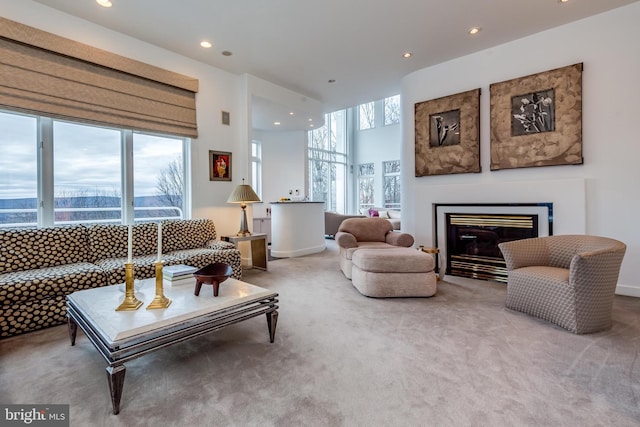 carpeted living room featuring plenty of natural light