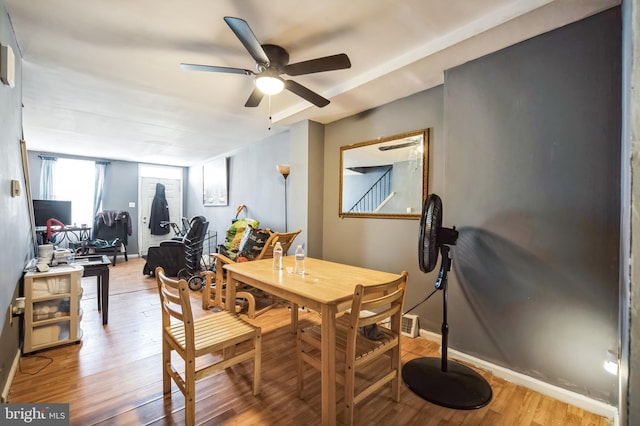 dining space featuring light hardwood / wood-style flooring and ceiling fan