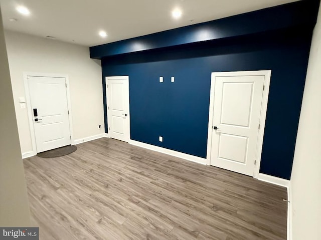 spare room with hardwood / wood-style floors