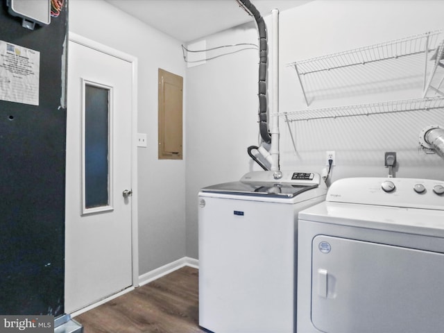 laundry area featuring independent washer and dryer, electric panel, and dark hardwood / wood-style floors