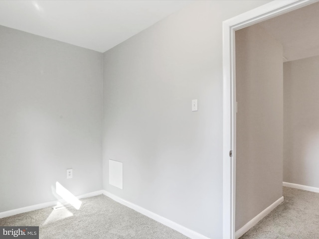 empty room with light colored carpet