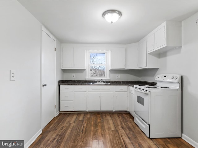 kitchen with white cabinets, sink, and white electric range