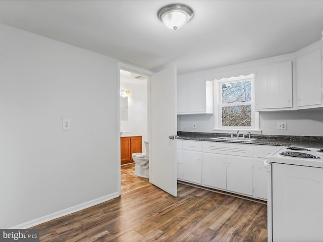 kitchen featuring white cabinetry, sink, dark hardwood / wood-style flooring, and electric stove