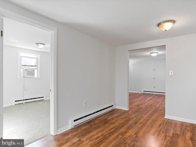 unfurnished room with cooling unit, dark wood-type flooring, and a baseboard radiator