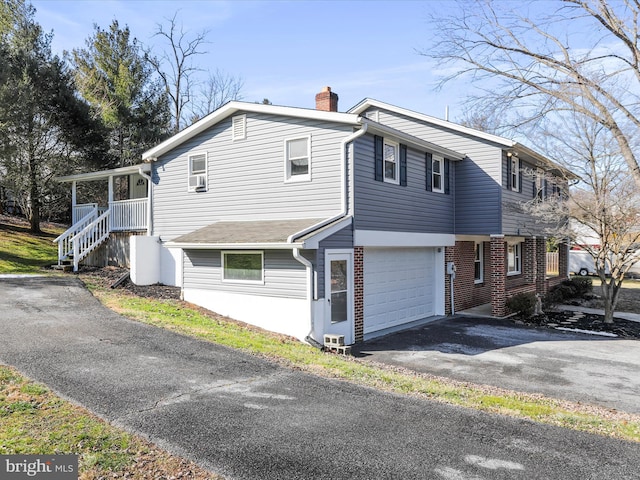 view of property exterior with a garage