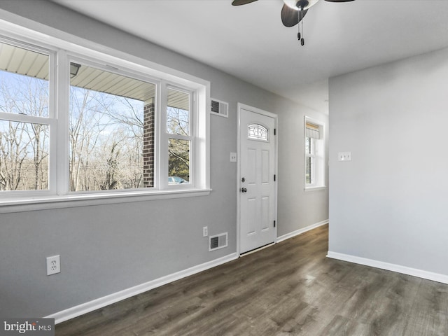 foyer entrance featuring dark hardwood / wood-style flooring and ceiling fan