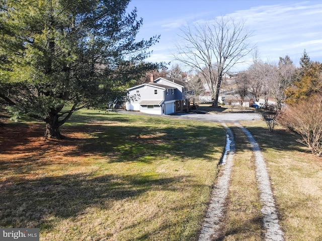 view of yard featuring a garage