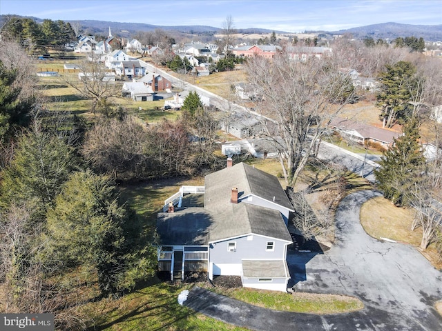 birds eye view of property with a mountain view