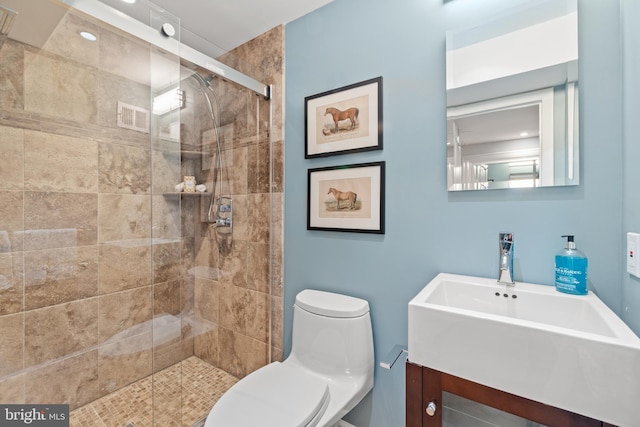 full bath featuring visible vents, a stall shower, vanity, and toilet