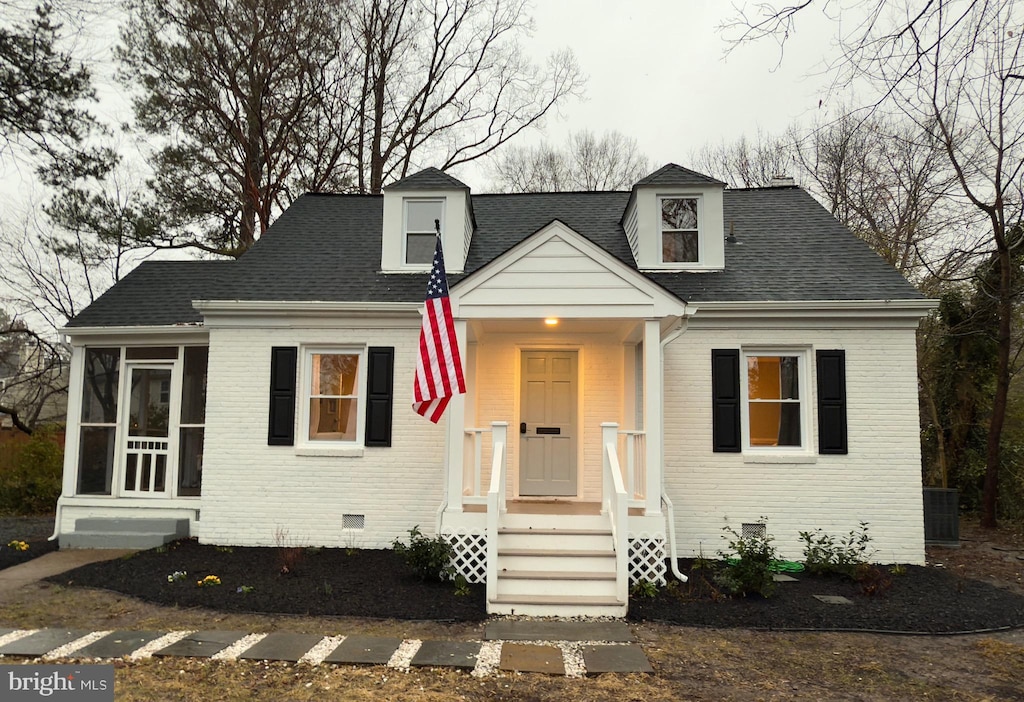 cape cod-style house with a sunroom