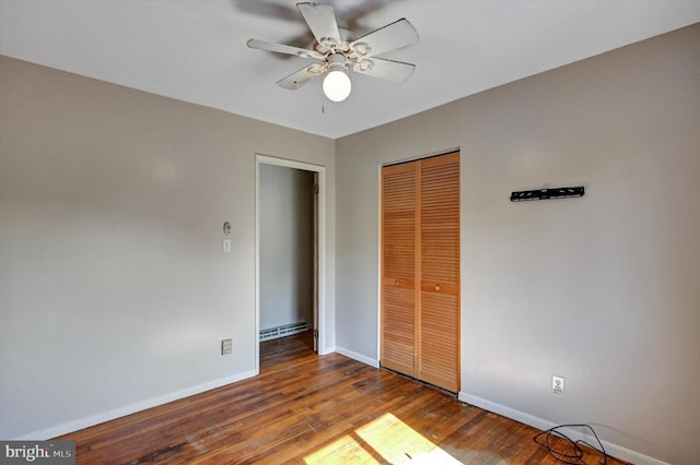 unfurnished bedroom featuring wood-type flooring, ceiling fan, and a closet