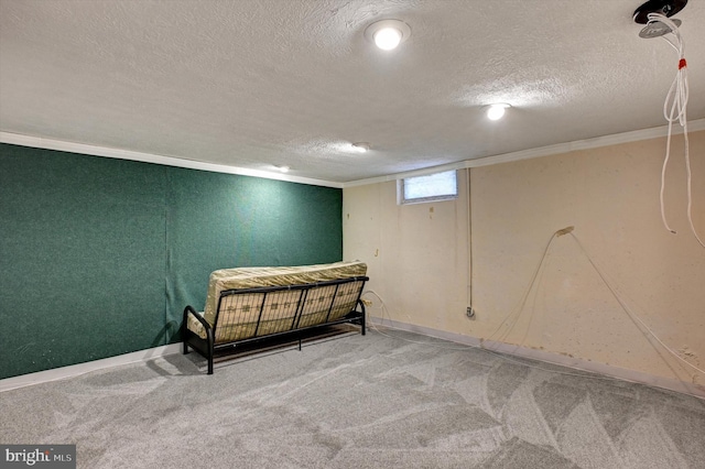 carpeted bedroom with ornamental molding and a textured ceiling