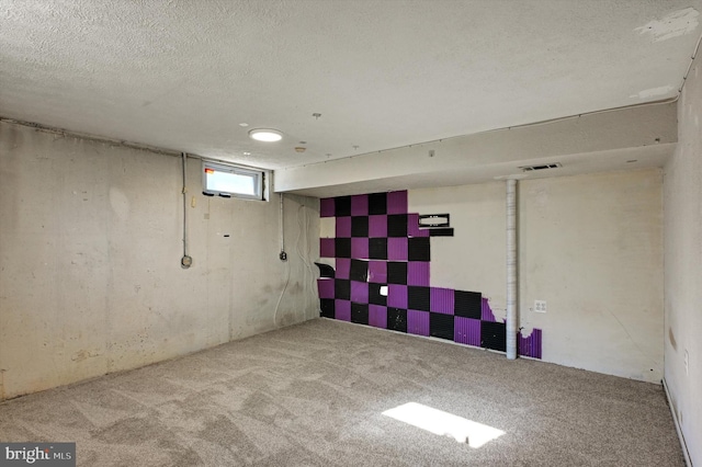 basement featuring light colored carpet and a textured ceiling