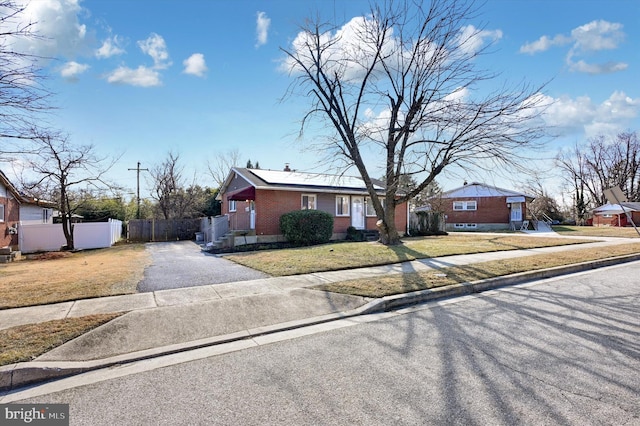 ranch-style home with a front yard