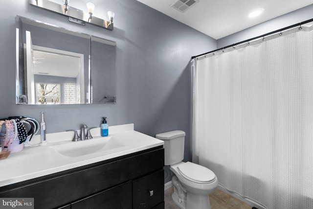 bathroom with vanity, toilet, shower / bathtub combination with curtain, and visible vents