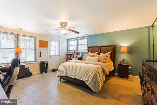 bedroom featuring ceiling fan and light wood-type flooring