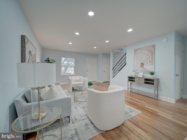 living room with light hardwood / wood-style flooring