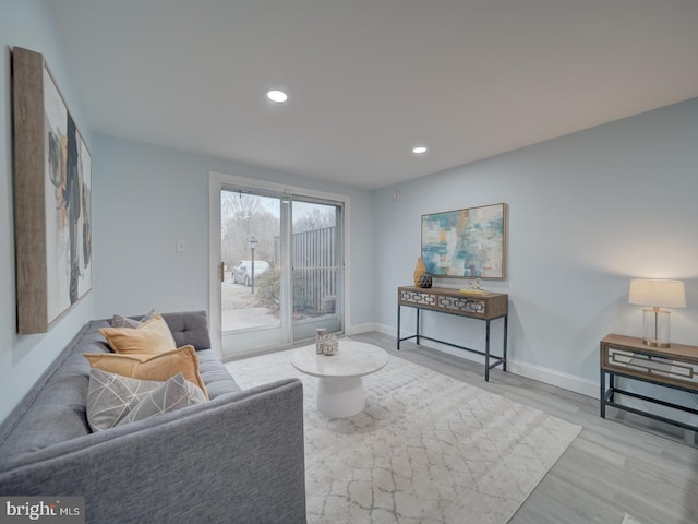 living room with light hardwood / wood-style flooring