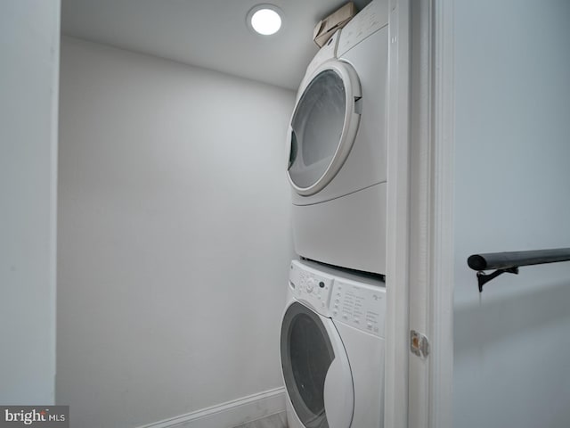 washroom with stacked washer and dryer