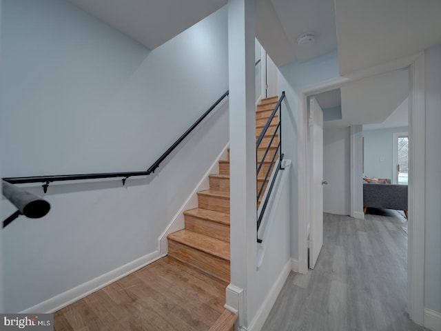 stairway featuring wood-type flooring