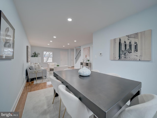 dining space with light hardwood / wood-style flooring