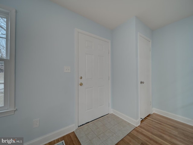 entryway with light hardwood / wood-style flooring