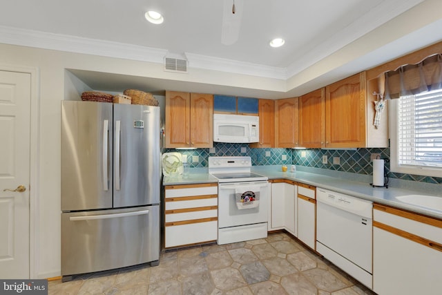 kitchen featuring crown molding, backsplash, white appliances, and sink