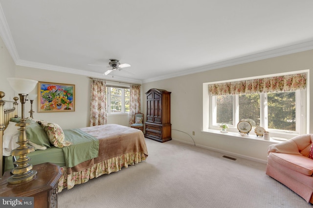 bedroom with crown molding, light colored carpet, and ceiling fan