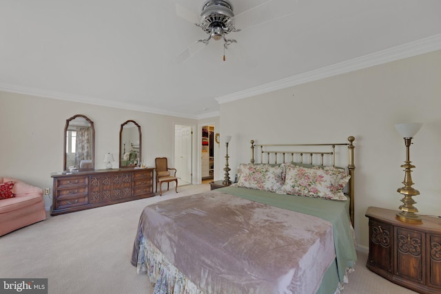 carpeted bedroom featuring crown molding and ceiling fan