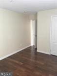 spare room featuring dark hardwood / wood-style flooring