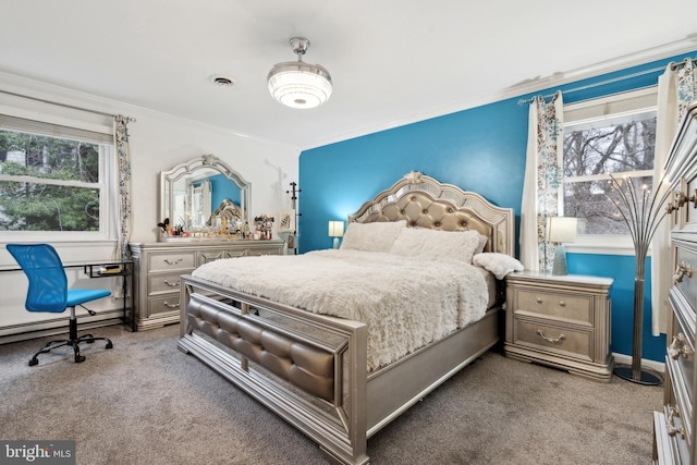 bedroom with baseboard heating, crown molding, and carpet floors