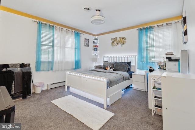 carpeted bedroom with a baseboard radiator