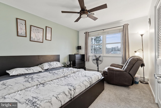 bedroom featuring ceiling fan and light carpet