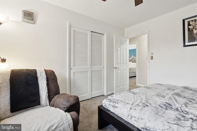 bedroom with light colored carpet, a closet, and ceiling fan