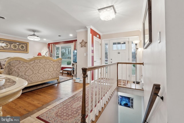 interior space with light tile patterned floors and crown molding