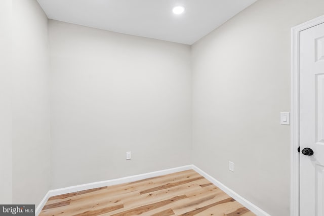 empty room with hardwood / wood-style floors