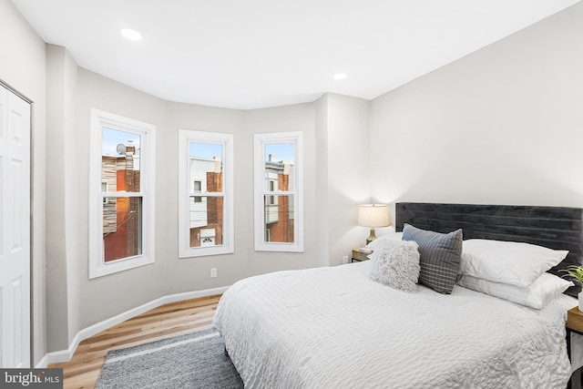 bedroom with hardwood / wood-style floors