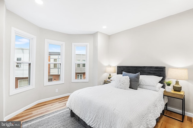 bedroom with wood-type flooring