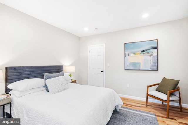 bedroom with wood-type flooring